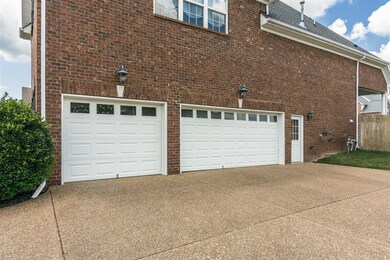 Over sized 3 car garage gives you room for everything! The pedestrian door is a nice bonus as well.