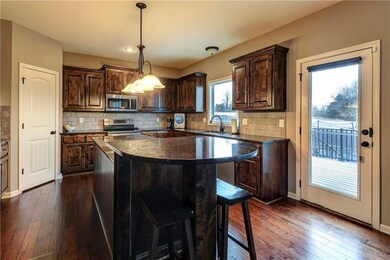 Gleaming hardwoods throughout entry and kitchen! G