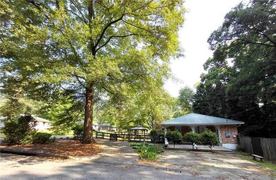 View of wooden deck in front of the property. Enjoy early morning coffee or late afternoon pizza and martinis