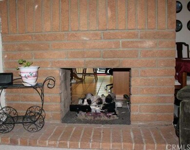 Double sided fireplace looking into the kitchen