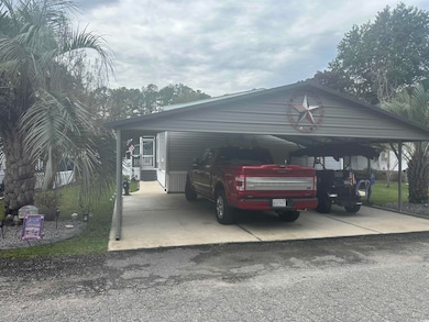 View of car parking featuring asphalt driveway
