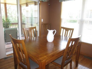 Dining Room overlooks the covered enclosed deck.