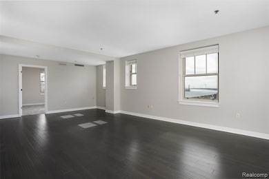 Unfurnished room with dark wood-style floors