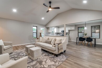 Living room looking into dining and kitchen