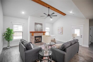 Beautiful brick fireplace with cedar mantle!