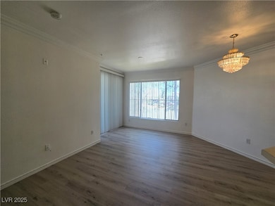 Spare room featuring crown molding, a smoke detect