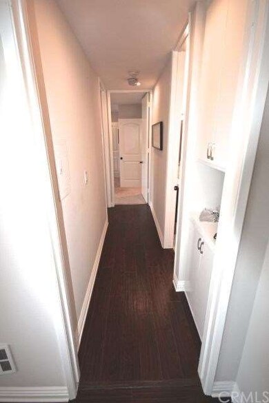 Hallway leading two bedrooms and second bath. Doub