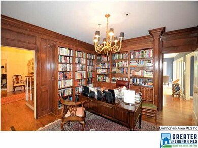 Library has beautiful custom shelving and is adjac
