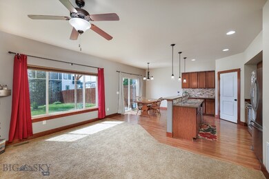 living/kitchen/dining looking out to backyard