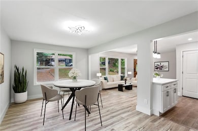 Dining space with recessed lighting, baseboards, a