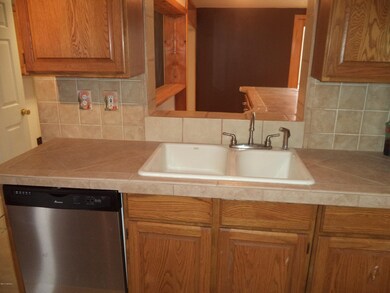 Kitchen with pass through to bar/AZ room