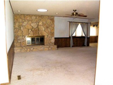 Upstairs family room with fireplace.