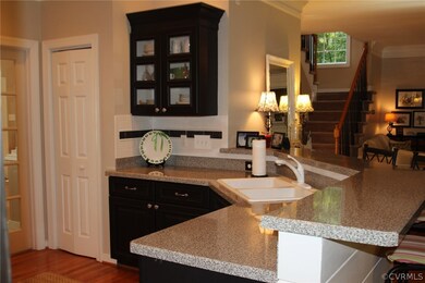Kitchen pantry and glass front cabinet.