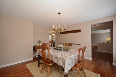 To the left of the front door is the dining room. 