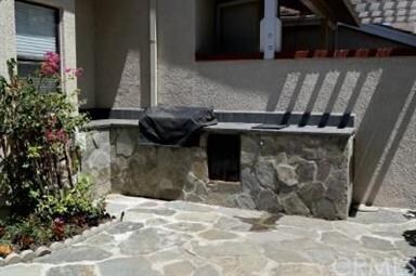 Private patio includes a built-n barbecue