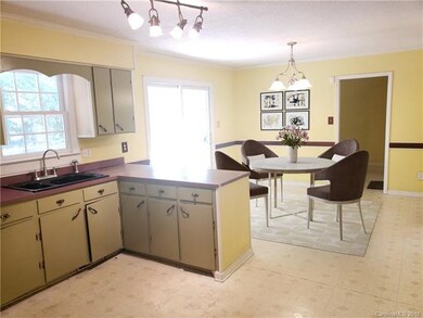 Virtually staged kitchen/dining area.