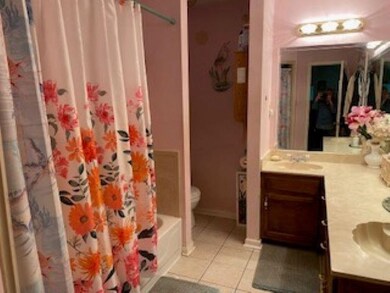 Bathroom featuring toilet, tile patterned floors, 