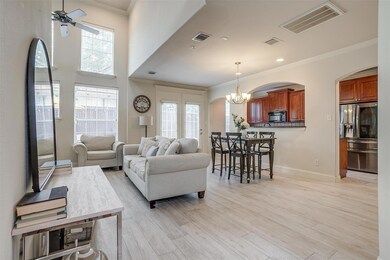 Bright and airy living room with soaring ceilings,