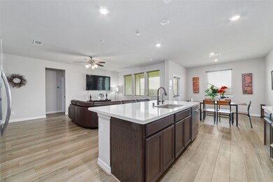 Kitchen that flows into the living room.