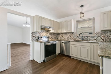 Enjoy cooking your family meals in this wonderful kitchen featuring more than ample cupboards, granite countertops and newer SS appliances (included).