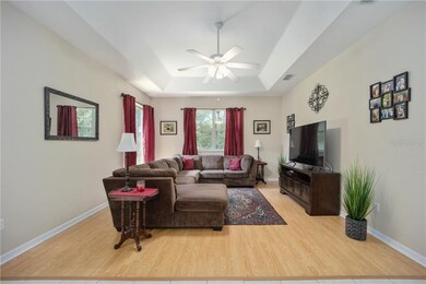 Family Room with Tray Ceiling & Patio Access