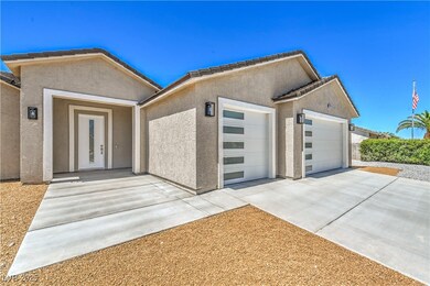 View of front of house featuring a garage, a tiled
