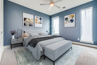 Bedroom with carpet flooring and a ceiling fan