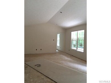 spacious family room with vaulted celing