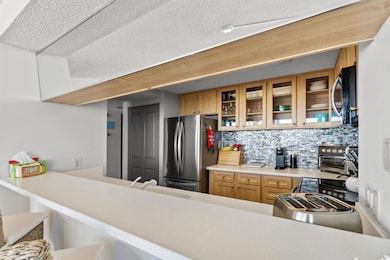 Kitchen with stainless steel appliances, sink, a t