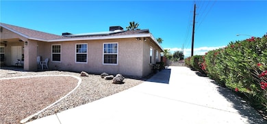 View of side of home with roof mounted solar panel