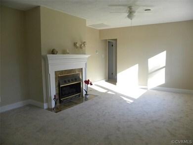 Living Room with Gas Fireplace, Ceiling Fan, New Carpet and Paint