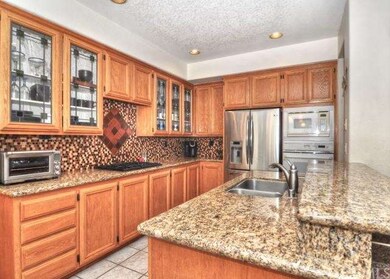 The kitchen is open to the family room and boasts 