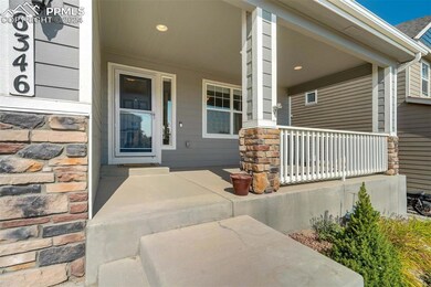 View of exterior entry featuring covered porch