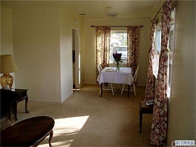 Comfortable living room with many windows.