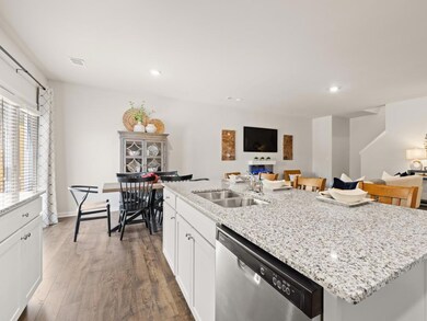 sudbury townhome kitchen with white cabinets and g