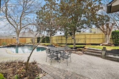 Backyard oasis boasts a pool with waterfall and brand new rear fence!