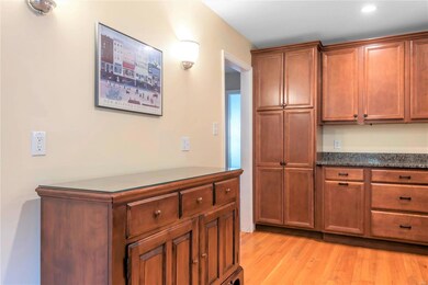 Beautiful cabinetry, including a large pantry-style cabinet. Convenient buffet. And, oh, those hardwood floors!!