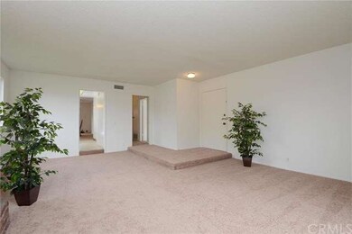 Living room looking toward the front door and kitc