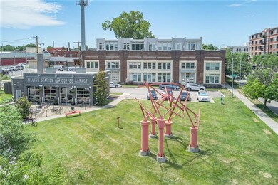 Sculpture in the park area along with the coffee shop/restaurant next door.