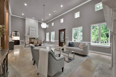 Along with the dual floor to ceiling fireplaces, there is access to a fantastic walk through butlers pantry that features a wet bar, stand alone icemaker, and a beverage refrigerator.