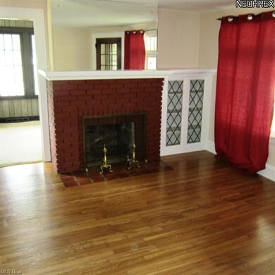 WEST UNIT LIVING ROOM WITH REFINISHED HARDWOOD FLOORS