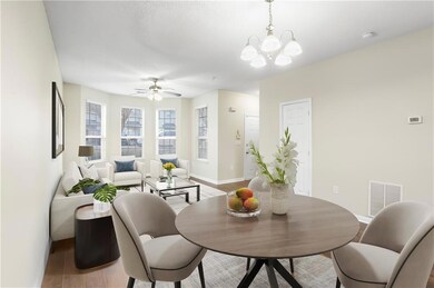 Dining room with ceiling fan and a chandelier