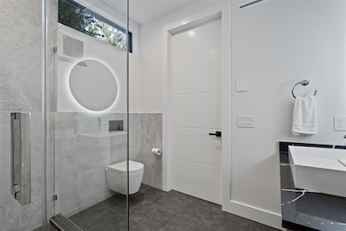 Full bathroom featuring tile walls, tile patterne