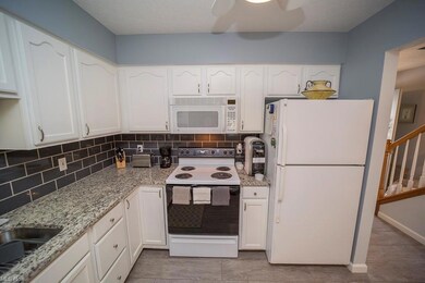 Beautiful granite counters with plenty of cabinets