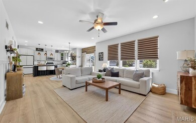 Great Room with fireplace, Wainscoting and Luxury LVP Flooring