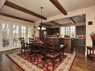 Charming breakfast area with french doors leading 