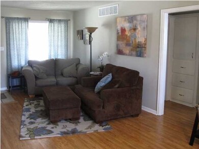 WARM WALL TONES, NEWLY ADDED WOOD LAMINATE FLOORS,