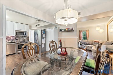 Dining room featuring hardwood / wood-style floors and beamed ceiling