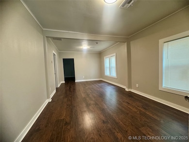 Empty room with ornamental molding, dark wood-styl