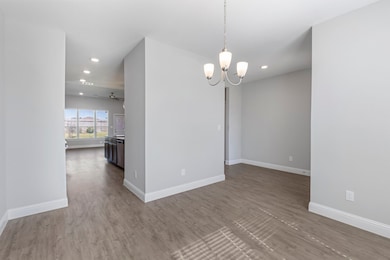 The open layout flows into the kitchen and family room.